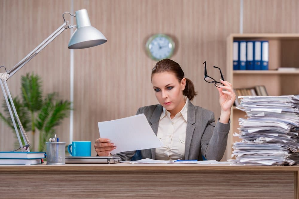 A municipal clerk reviewing a contract.