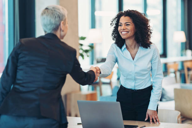A municipal clerk shaking hands with a vendor after a successful negotiation.