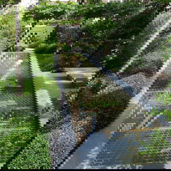 Grachtentuin tuinontwerp Van Raaijen Hoveniers Robert Broekema fotografie bank